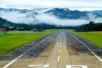 Airport runway with mountain in countryside