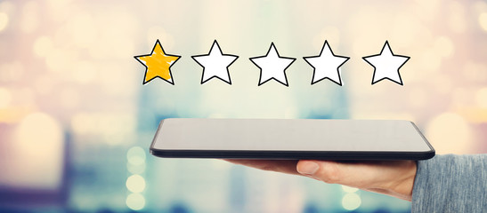 One Star Rating with man holding a tablet computer
