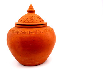 Thai style clay pot with white backdrop.
