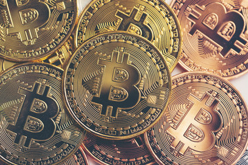 business success and money concept with bitcoins