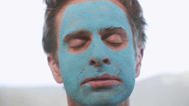 Man With Cracked Blue Facial Mask