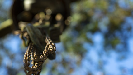 Chains attached to a hook and blurred background