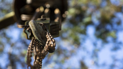 Chains attached to a hook and blurred background