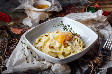 Pasta with carbonaria, spaghetti with hard parmesan and cheese-sauce. Traditional Italian cuisine. Pasta al-Carbonara