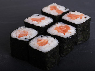 Maki rolls with over grey background. Japanese Sushi. close up. 