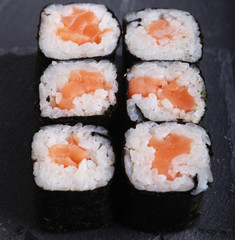 Maki rolls with over grey background. Japanese Sushi. close up. 
