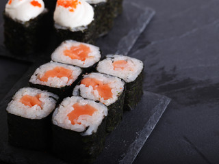 Maki rolls with over grey background. Japanese Sushi. close up. 