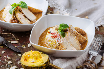 Chicken breast grilled with basmati rice on a white plate with brown sauce. Autumn menu