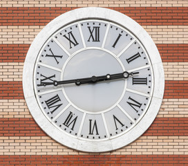 clock on brick wall background