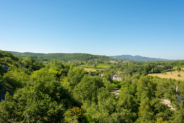 Fototapeta na wymiar Beautiful panoramic view of the landscape in front of a bright blue sky by the river Ardeche in the south of France