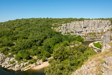 Fototapeta na wymiar Panorama Landscape by the river Ardeche, framed by trees and gorges at 
