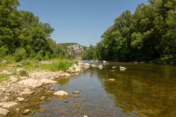 View of the river Ardeche with its stony shore near the small village Chauzon in the south of France