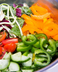 Close up of fresh organic ingredients for making vegetable salad