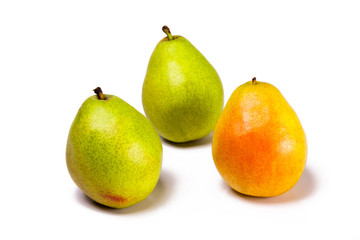 Three pears on a white background.  Healthy organic fresh fruit snacks