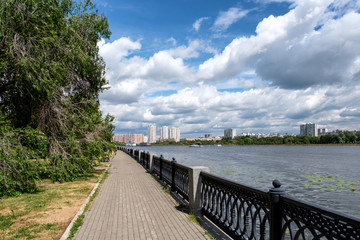 Fototapeta na wymiar City landscape with a river and embankment. Moscow, Russia