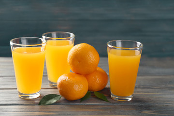 Fresh citrus juice in glasses on table