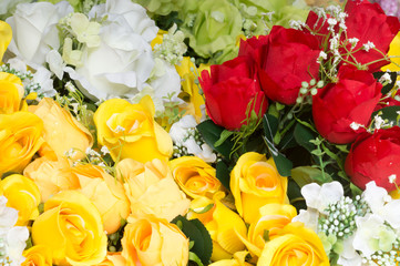 Background of different colorful artificial flowers