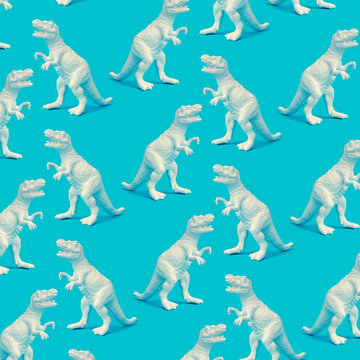 Creative white painted dinosaur pattern on blue background. Abstract art background. Minimal concept for kids. © Zamurovic Brothers