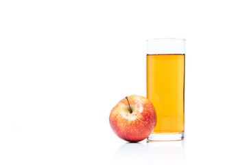 close up view of glass of apple juice and fresh apple isolated on white