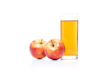 close up view of glass of apple juice and fresh apples isolated on white
