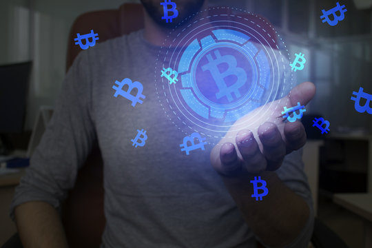 Crypto currency in hand, additional reality, holographic display, neon light, abstract background