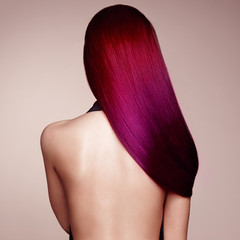 Fototapeta premium Beauty Fashion Model Girl with Colorful Dyed Hair. Girl with perfect Hairstyle. Model with perfect Healthy Dyed Hair. Pink Hairstyles