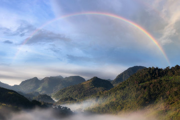 Fototapeta na wymiar Mountain and mist with rainbow.
