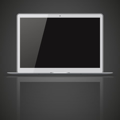 Modern laptop with black and blank screen on gray background.