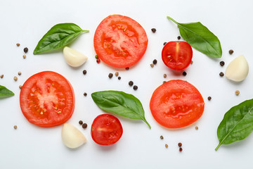 Composition with fresh vegetables, herbs and spices on white background