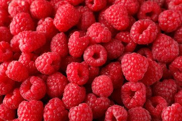 Fresh ripe raspberries as background