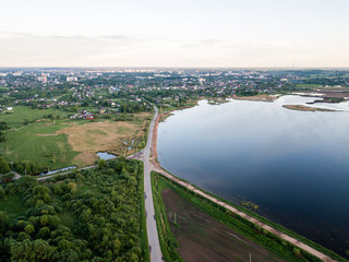 Beautiful Aerial view of a village and blue lake on summer day. 