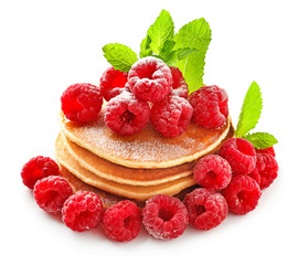 Tasty homemade pancakes with raspberries on white background