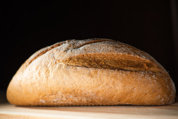 Healthy organic homemade bread on wooden table.