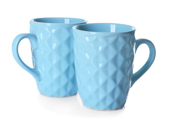 Color cups on white background