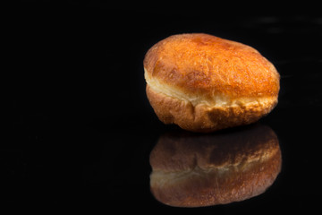 Appetizing donut on a black background.