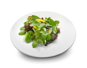 Plate with healthy vegetable salad on white background