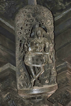 Shilabalika, celestial maiden, Keshasamvarani, hair dressing, on top of the pillars inside the main hall. Chennakeshava temple, Belur, Karnataka.