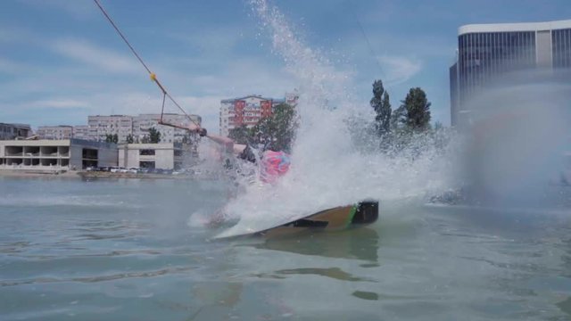 a young guy is riding a hydrocycle on the lake