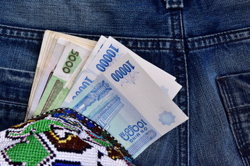 Uzbek national money in a nice clutch purse