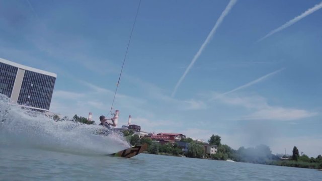 a young guy is riding a hydrocycle on the lake