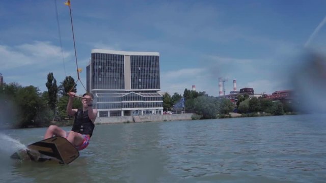 a young guy is riding a hydrocycle on the lake