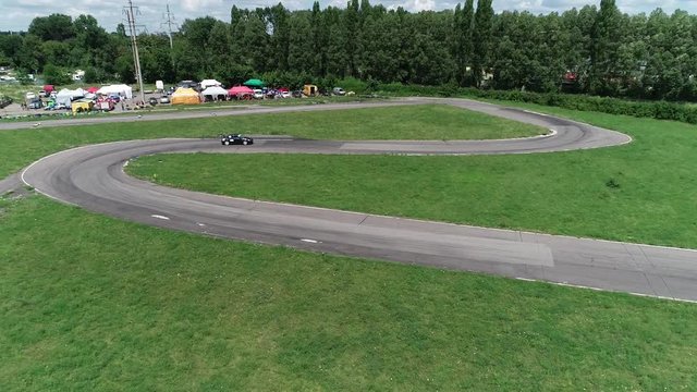 Air shooting, fast racing car rides on a twisty track