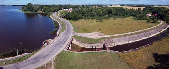 Old lake dam and road panorama, aerial view