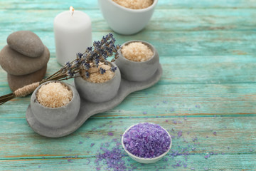 Fototapeta na wymiar Spa composition with beautiful lavender and sea salt on wooden table