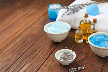 Composition with spa cosmetics and lavender on wooden table