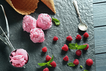 Composition with tasty raspberry ice-cream on slate plate