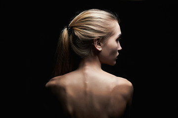 young woman with naked back