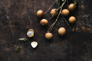 Fresh longan, Dimocarpus longan on rustic background