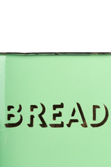 Wording on the side of a vintage 1930s green enamel bread bin. Potential use as background for recipe / ingredients / bakery price list.