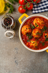 Chicken meatballs with tomato sauce. Served with rice.